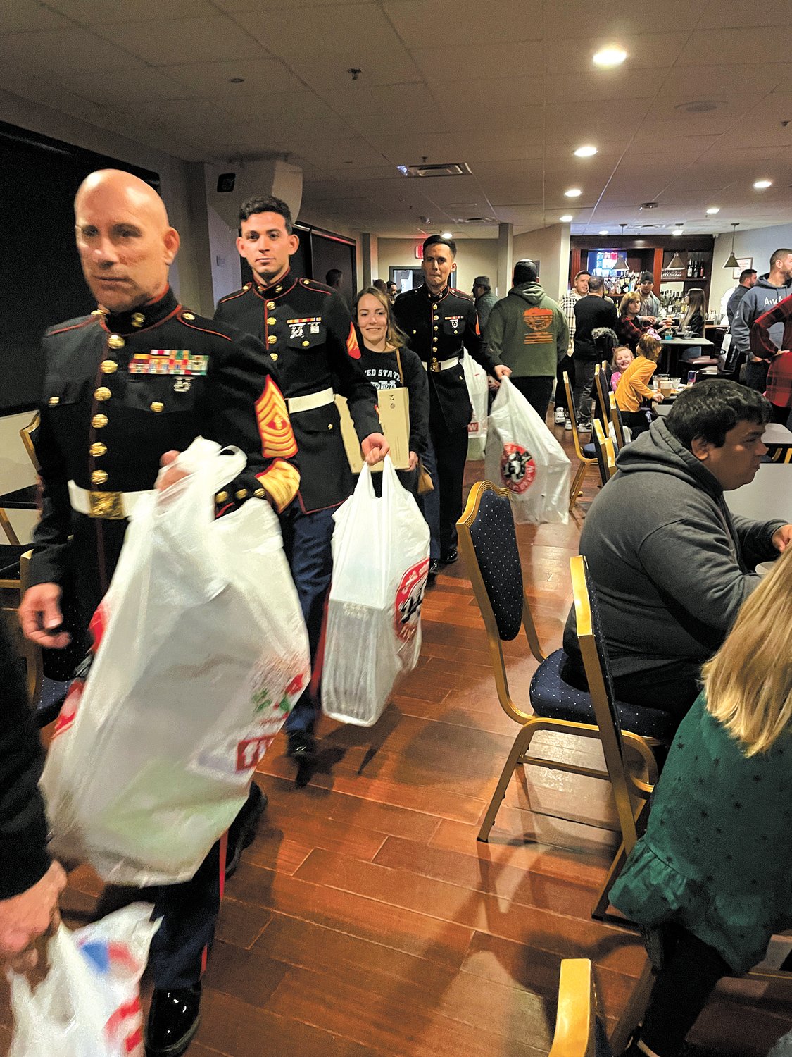 THE TOYS KEPT COMING: Members of the Marine Corp help deliver toys for Cranston kids.